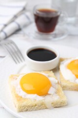 Tasty kaya toasts with half-boiled eggs served on table, closeup. Traditional asian breakfast