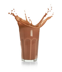 Chocolate milk splashing in glass on white background