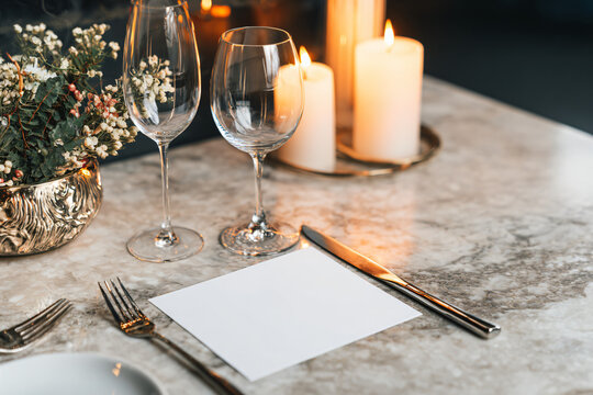 sophisticated wedding menu card mockup positioned on marble dining table, luxury restaurant interior
