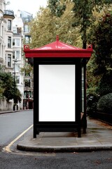 Empty billboard on a red-roofed bus shelter in a city street