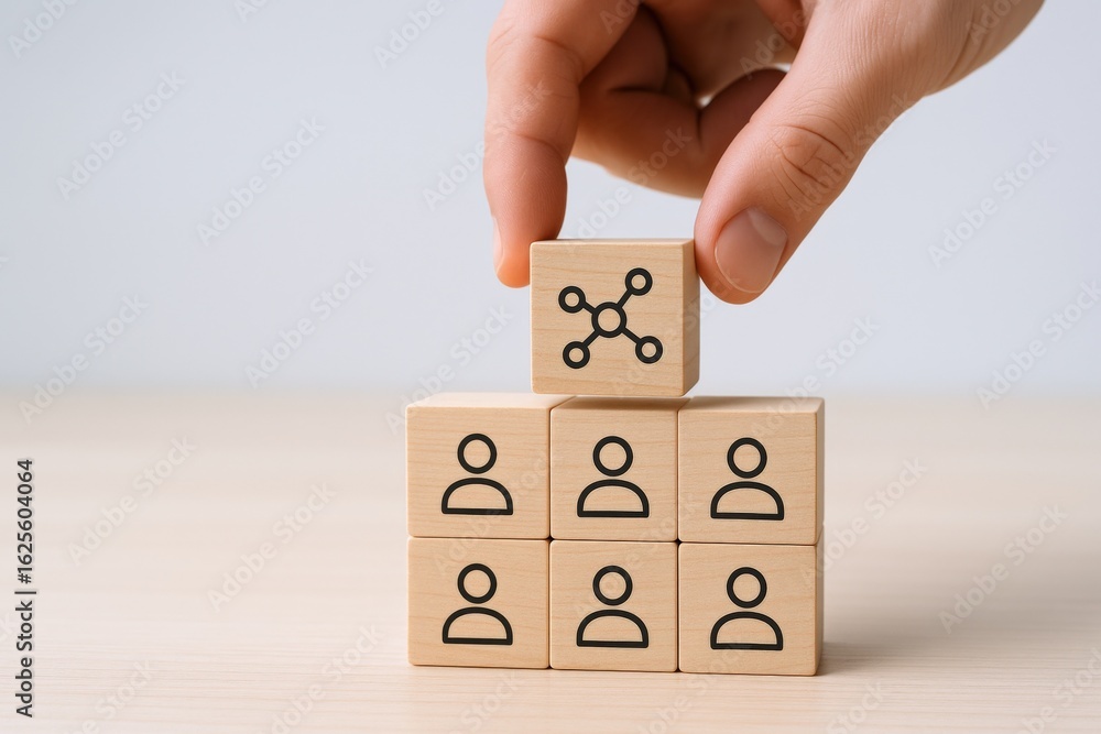 Poster building business structure: hand placing wooden block with network icon on top of people hierarchy