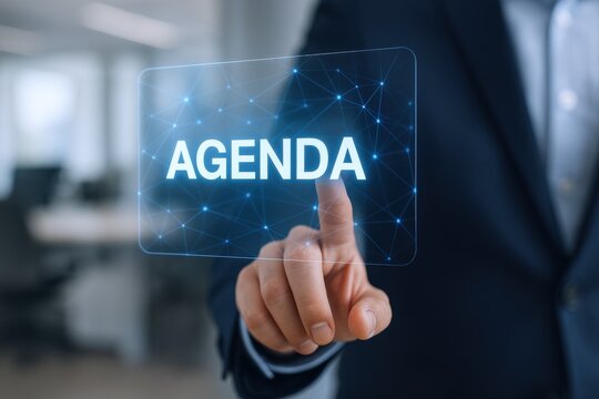 Businessman Touching 'Agenda' on a Futuristic Interface: Strategic Planning and Digital Transformation Concept