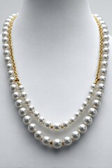 Obraz premium Lustrous Two Strand Pearl Necklace Close Up Display High Quality Off White Pearls In Elegant Studio Design, Creamy Sheen On White Mannequin