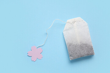 Tea bag on blue background, closeup