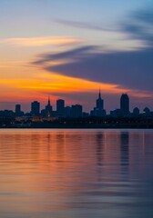 Vibrant cityscape skyline silhouette at sunset with water reflection, ideal for urban digital backgrounds