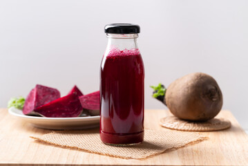 Fresh beetroot juice in bottle on wooden, Healthy drink