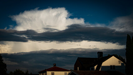 clouds above rooftops