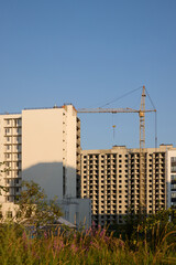 Construction Site Featuring a Crane Set Against a Beautifully Clear Blue Sky Above