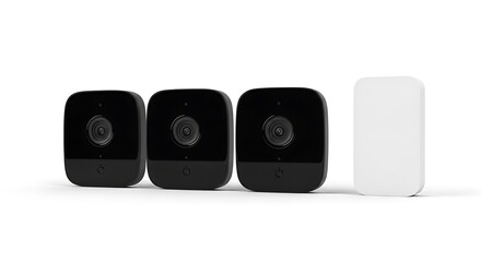 Obraz premium Wireless Security Camera System with Three Black Cameras and White Base Station