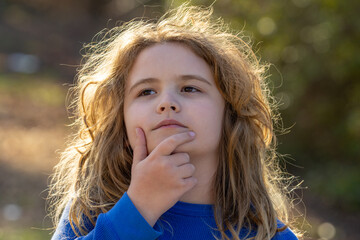 Child mind full of imagination. Blonde child thinking peacefully. Little dreamer. Child imagining...