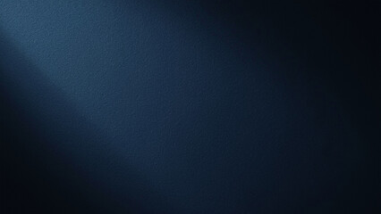 A soft beam of light cuts diagonally across a dark, textured navy blue background.