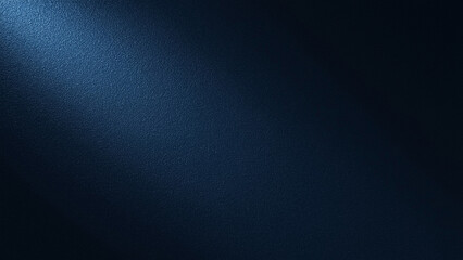 A single spotlight shines down from the top left, illuminating a dark blue textured background.