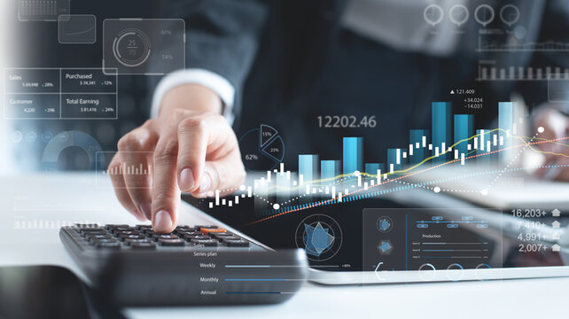Business, finance and investment concept. Businessman analyzing and calculating financial data with economic graph growth chart, digital market research, financial report
