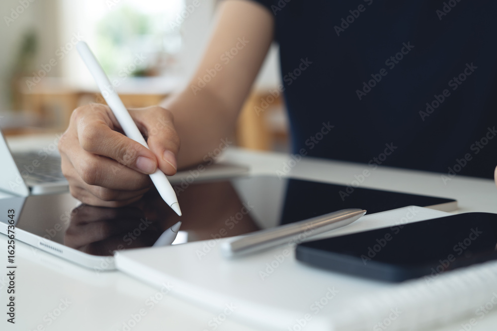 Poster woman using stylus pen signing e-document on digital tablet with laptop computer on table at coffee 