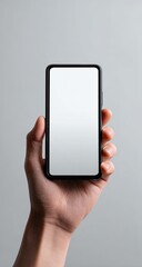 Hand holding a black smartphone with blank screen