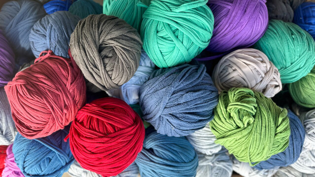 Colorful recycled fabric yarn balls, also known as trapillo or totora thread. Made from upcycled textiles, ideal for eco-friendly crafts, macram&eacute;, crochet, and DIY projects
