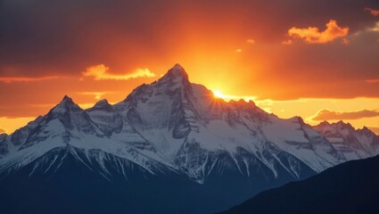 Golden Sunset Over Snow-Capped Alpine Mountains with Glowing Sky