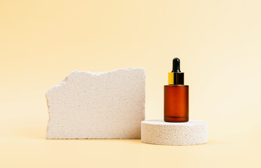 Cosmetic bottles on a stone podium, package for mock up on a beige background. The concept of...
