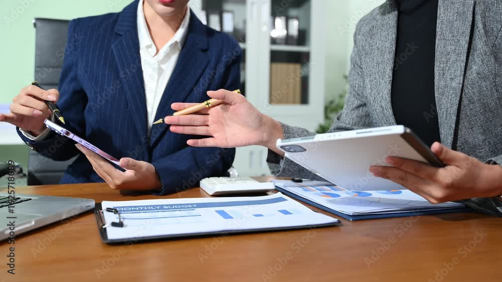 Poster business documents on office table with smart phone and calculator digital tablet and graph business