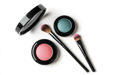 Cosmetic products and makeup brushes arranged on a white background