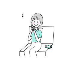 カラオケで歌う女性