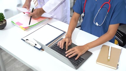 Medical Professionals' Collaboration: Two medical experts engaged in a consultation at a modern workspace, a portrait of collaboration and professional healthcare. - Powered by Adobe