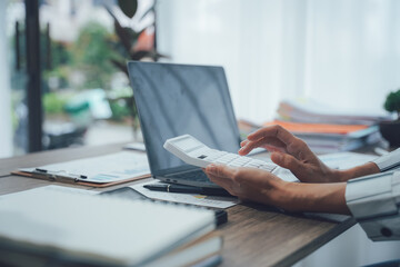 Fototapeta premium Two business people talk project strategy at office meeting room. Businessman discuss project planning with colleague at modern workplace while having conversation and advice on financial data report.