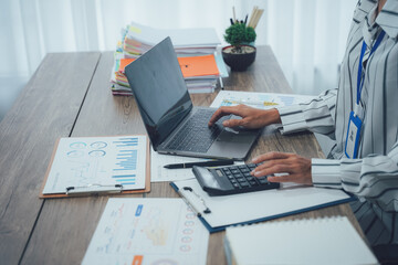 Two business people talk project strategy at office meeting room. Businessman discuss project planning with colleague at modern workplace while having conversation and advice on financial data report.