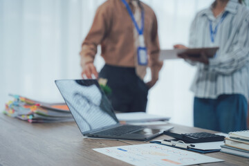 Office workspace: A contemporary office workspace, bathed in natural light, featuring a laptop,...