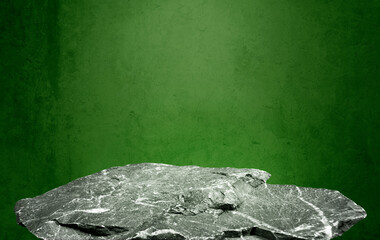 stone granite podium at foreground with green concrete background and light from above. Product...