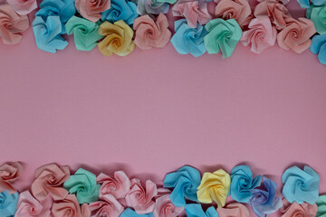 Origami is a traditional Japanese paper craft in which colored paper is folded into shapes such as flowers. This is a piece folded into the shape of a rose.