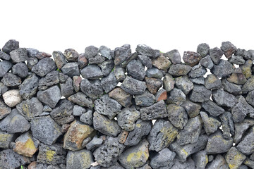 Jeju traditional stone wall made of volcanic rocks protecting homes and fields in a scenic rural landscape