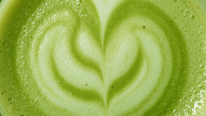Green Tea Matcha Latte with Beautiful Foam Art. Close-up of Matcha Latte background.