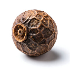 A single dried allspice berry, used whole or ground in cooking for its warm,