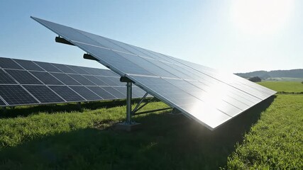Dynamic solar panel array generating clean energy in a bright, sunny field, reflecting a sustainable future and innovative technology for eco-conscious solutions - Powered by Adobe