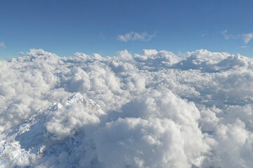 High-altitude view of snow-capped mountains piercing a vast expanse of cumulus clouds under a vibrant blue sky