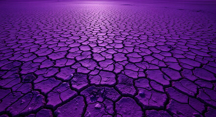 Intense violet landscape revealing cracked earth formations under a radiant light source
