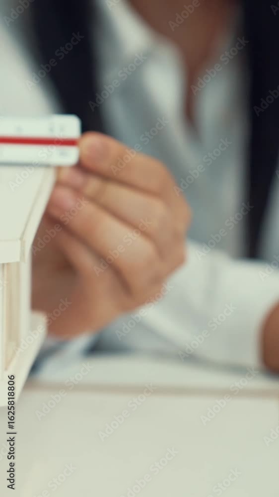 Poster professional male engineer measure house model by using ruler while beautiful cooperative coworker w