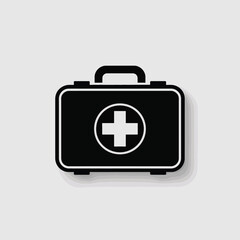 Black medical first aid kit icon with white cross on a light gray background