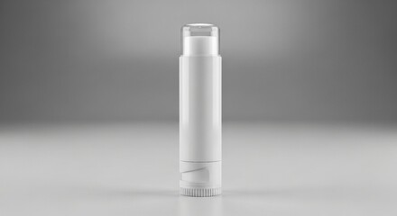 A blank, white lip balm tube with a clear cap stands alone, ready for cosmetic branding on a reflective surface in a neutral studio setting.
