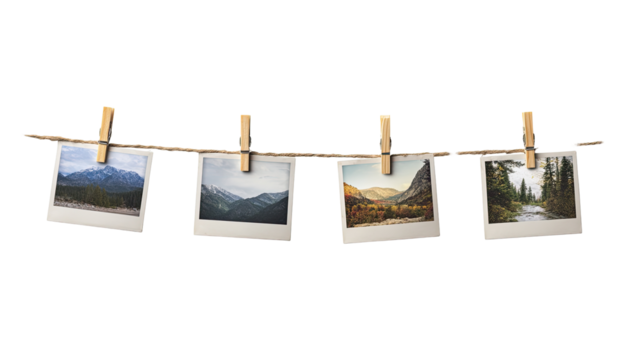 Four vintage-style photos of mountain landscapes, pinned to a clothesline