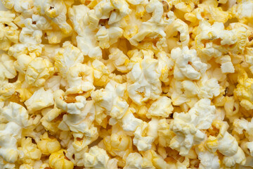 Tasty popcorn close up background top view
