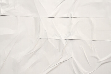 white crumpled and creased glued wrinkled paper poster texture background