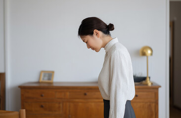 Korean woman leaning over customer with depressed expression