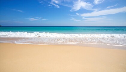 Tranquil beach scene with gentle waves lapping golden sand under a vibrant blue sky