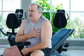 A man experiences chest pain or tightness while exercising at the gym.