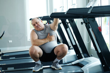 An overweight man is experiencing chest pain and tightness in his chest.