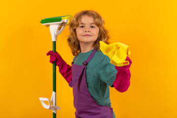 Portrait of child cleaning, concept growth, development, family relationships. Housekeeping and home cleaning concept. Child use duster and gloves for cleaning. Studio isolated background.