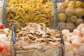 preserved mushrooms and veggies at the market