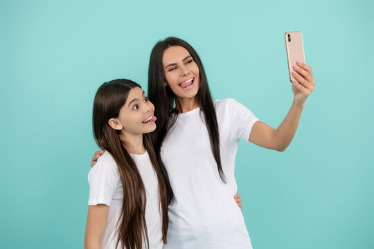 Selfie with mother and daughter. Capture the moment, cherish the memory. Portrait together with mother and daughter. Mother and daughter capturing selfie. Mother and daughter make selfie.